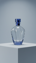 Sculpted glass perfume bottle with blue accent